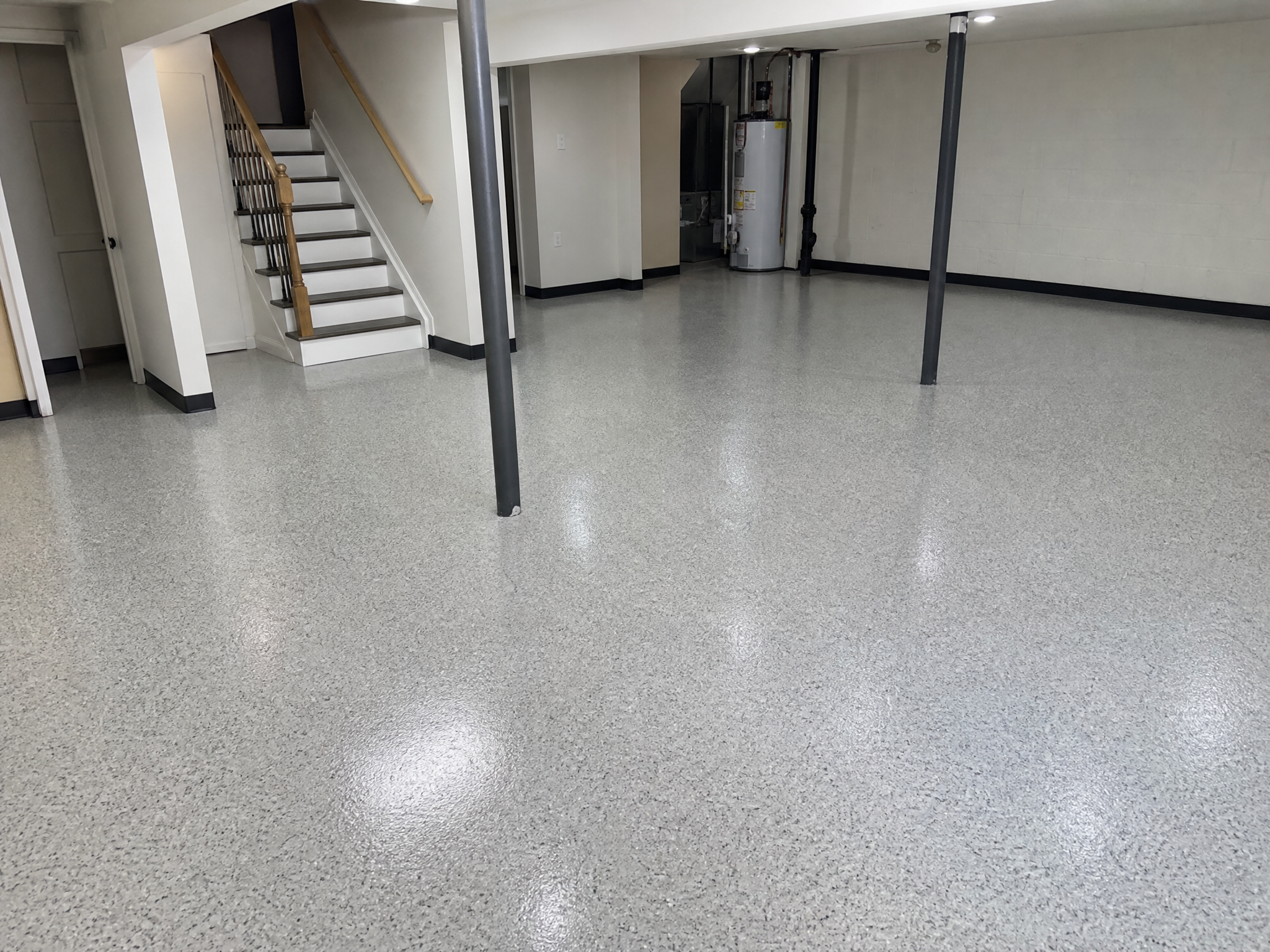 Completed basement epoxy floors showing professional quality workmanship in a American home